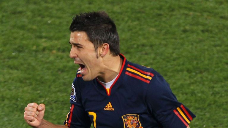 David Villa roars with delight.