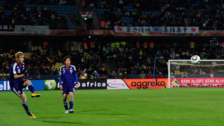 Keisuke Honda curls a free-kick goalwards.