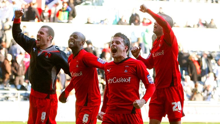 Leyton Orient players celebrate victory over Swansea