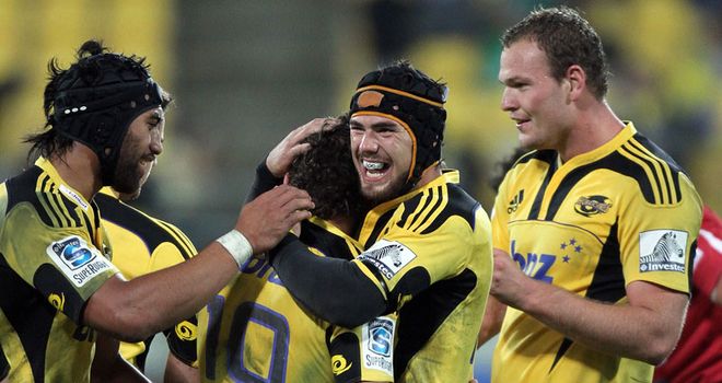 Celebration: Cruden is mobbed by team-mates after winning kick