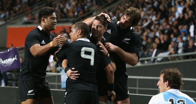 Hat-trick hero Corey Jane is congratulated by his New Zealand team-mates