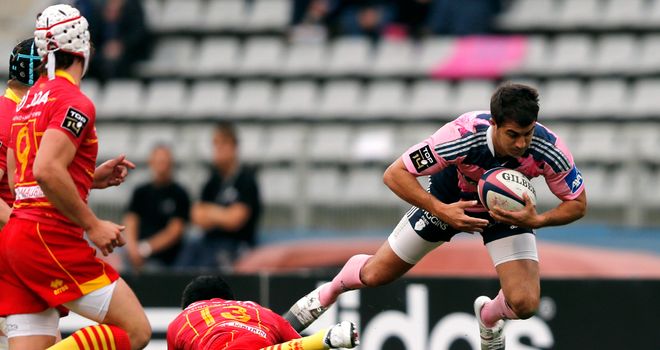 Stade Francais hero Jerome Porical is tackled by Perpignan&#39;s Lifeimi Mafi