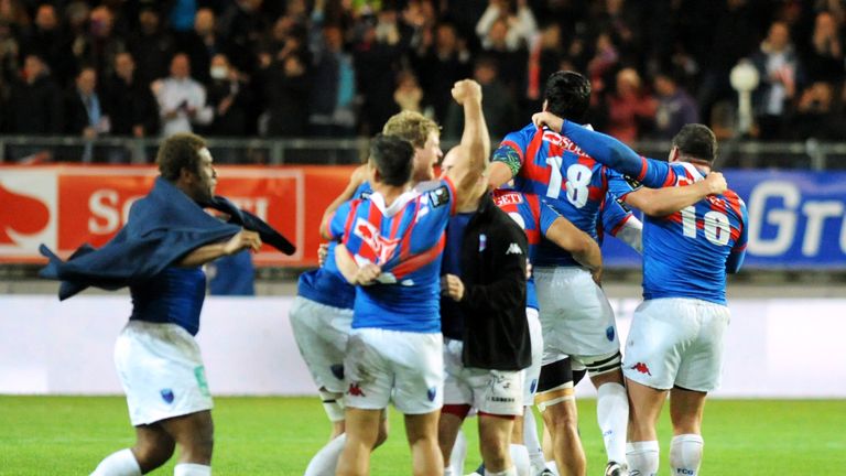 Grenoble's players celebrates after winning the French Top 14 rugby union match vs Toulon