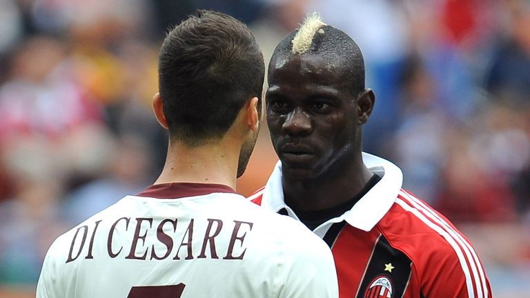 Mario Balotelli of AC Milan reacts to Valerio Di Cesare of Torino 