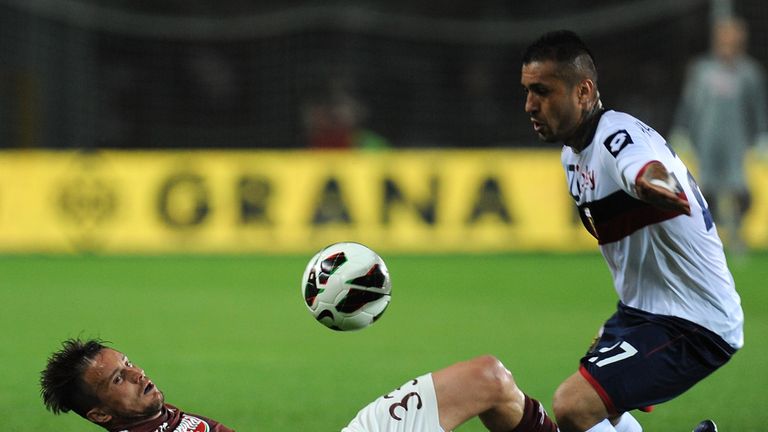 Matteo Brighi of Torino is tackled by Matuzalem of Genoa 