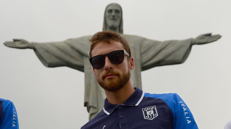 Italy's midfielder Claudio Marchisio poses for photographers in front of the Christ Redeemer statue on the Corcovado mount in Rio de Janeiro on June 13, 2013. Italy will embark on their second Confederations Cup football campaign starting on June 16 against Mexico with a strong squad which is poised to qualify for their 19th World Cup. AFP PHOTO / CHRISTOPHE SIMON        (Photo credit should read CHRISTOPHE SIMON/AFP/Getty Images)