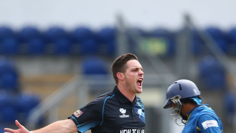 Mitchell McClenaghan celebrates the wicket of Tillakaratne Dilshan in Champions Trophy match between New Zealand and Sri Lanka in Cardiff
