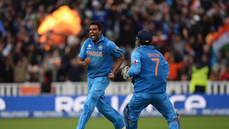 Ravichandran Ashwin of India celebrates the wicket of Joe Root of England with Mahendra Singh Dhoni during the ICC Champions Trophy Final