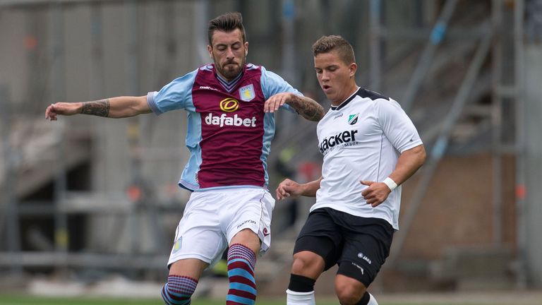 HIDDENHAUSERN, GERMANY - JULY 10: Antonio Luna of Aston Villa is challenged by Omar Guetat of SV Roedinghausen during the Pre Season Friendly match between SV Roedinghausen and Aston Villa at Hacker Wiehenstadion on July 10, 2013 in Hiddenhausen, Germany.  (Photo by Neville Williams/Aston Villa FC via Getty Images)