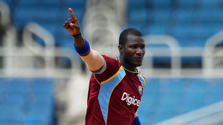 West Indies cricketer Darren Sammy celebrates dismissing Indian batsman Virat Kohli during the second match of the Tri-Nation series between Indian and West Indies at the Sabina Park stadium in Kingston on June 30, 2013. West Indies won the toss and elected to bat first.