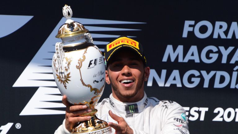Lewis Hamilton: Celebrates on the podium after his maiden race win for Mercedes in Hungary