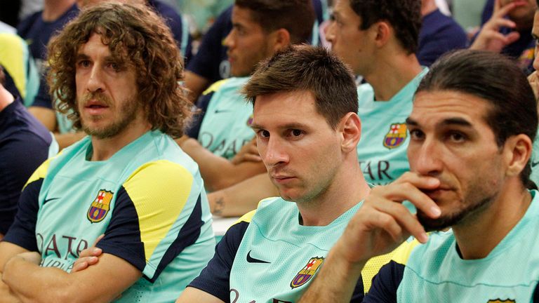 (FromL) Barcelona's captain Carles Puyol, Barcelona's Argentinian forward Lionel Messi and Barcelona's goalkeeper Jose Manuel Pinto attend a press conference given by Barcelona's President Sandro Rosell in Barcelona on July 19, 2013. Rosell confirmed during a news conference today that coach Tito Vilanova stepped down because he has suffered a relapse of cancer.  AFP PHOTO/ QUIQUE GARCIA        (Photo credit should read QUIQUE GARCIA/AFP/Getty Images)