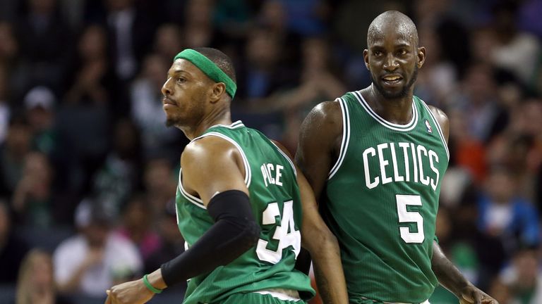 Team-mates Paul Pierce #34 and Kevin Garnett #5 of the Boston Celtics react after a basket against the Charlotte Bobcats