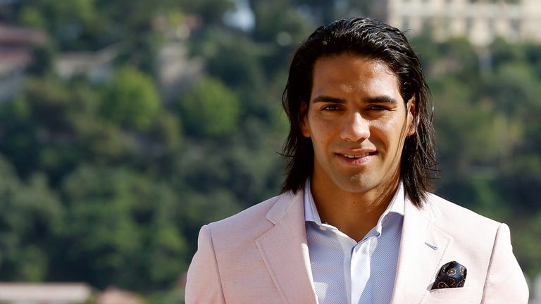 Colombian forward Radamel Falcao poses while holding his new jersey from French L1 Monaco football club after a press conference on July 9, 2013 in Monaco. Falcao, who was recruited by the club Monaco for around 60 million euros, said on July 9, 2013 he is aiming to help his new club become one of the best in Europe again. AFP PHOTO / VALERY HACHE        (Photo credit should read VALERY HACHE/AFP/Getty Images)