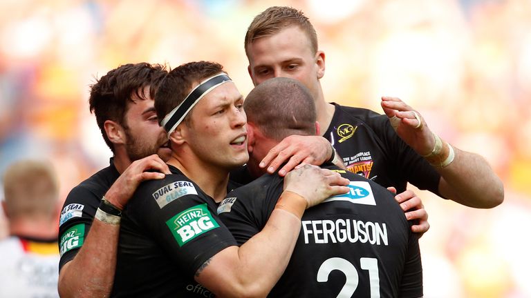 Dale Ferguson (R) of Huddersfield celebrates his try with team mates during the Super League Magic Weekend match between Bradford Bulls and Huddersfield Giants at the Etihad Stadium