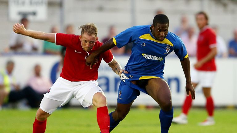 Chris Arthur of AFC Wimbledon (R) holds off Danny Green of Charlton during the Pre Season Friendly between AFC Wimbledon and Charlton Athletic at The Cherry Red Records Stadium on July 17, 2013