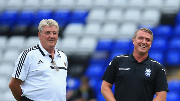 Hull manager Steve Bruce and Birmingham manager Lee Clark chat before the start of the Pre Season Friendly match between Birmingham City and Hull City at St Andrews