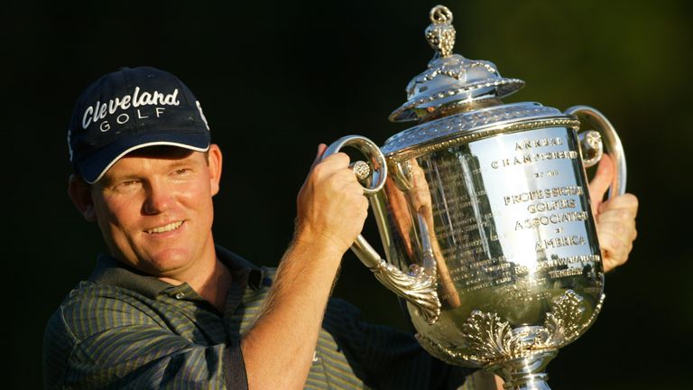 Shaun Micheel holds the trophy after winning the 85th PGA Championship at Oak Hill Country Club on August 17, 2003