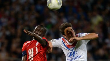 Idrissa Gueye vies for the ball with Clement Grenier