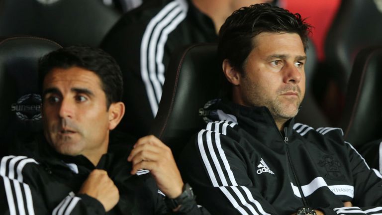 - Manager Mauricio Pochettino R of Southampton and assistant manager Jesus Perez look on during the Capital One Cup Third Round match between Southampton and Bristol City