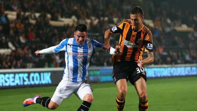HULL, ENGLAND - SEPTEMBER 24:  Adam Hammill of Huddersfield Town battles with Conor Henderson of Hull City during the Capital One Cup third round match between Hull City and Huddersfield Town at the KC Stadium on September 24, 2013 in Hull, England.  (Photo by Julian Finney/Getty Images)