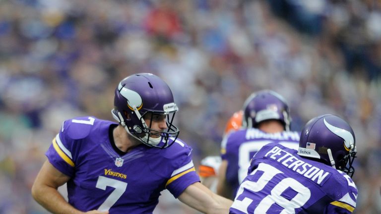 Minnesota Vikings quarterback Christian Ponder hands off the ball to running back Adrian Peterson