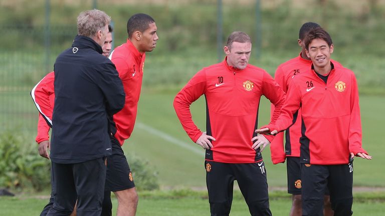 David Moyes, Wayne Rooney and Shinji Kagaw at Manchester United's Carrington Training Ground on September 16, 2013 in Manchester, England.