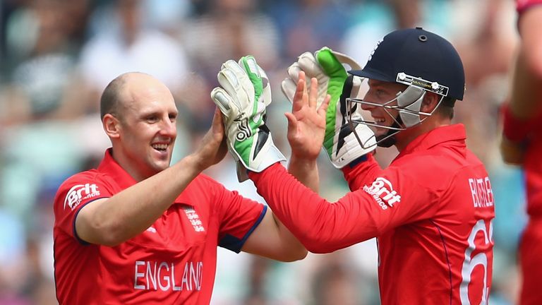 James Tredwell of England celebrates with Jos Buttler after taking the wicket of Jean-Paul Duminy of South Africa for 3 runs during the ICC Champions Trophy Semi-Final match between England and South Africa at The Kia Oval on June 19, 2013 in London, England