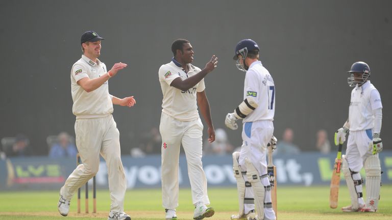 Warwickshire bowler Keith Barker celebrates with Boyd Rankin after dismissing Derbyshire batsman Paul Borrington during their LV County Championship match at the County Ground