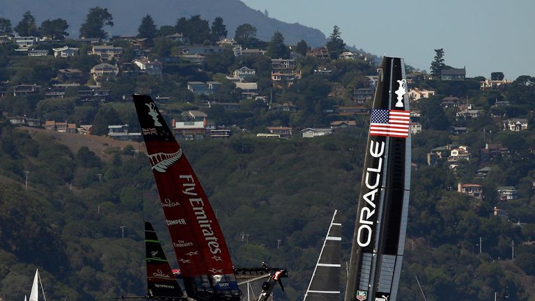 Emirates Team New Zealand almost capsizes while racing against Oracle Team USA during race eight of the America's Cup