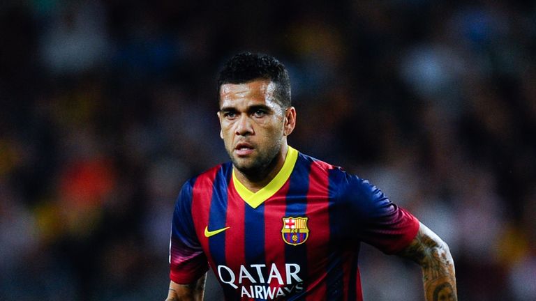 BARCELONA, SPAIN - SEPTEMBER 14:  Dani Alves of FC Barcelona runs with the ball during the La Liga match between FC Barcelona and Sevilla FC at Camp Nou on September 14, 2013 in Barcelona, Spain.  (Photo by David Ramos/Getty Images)