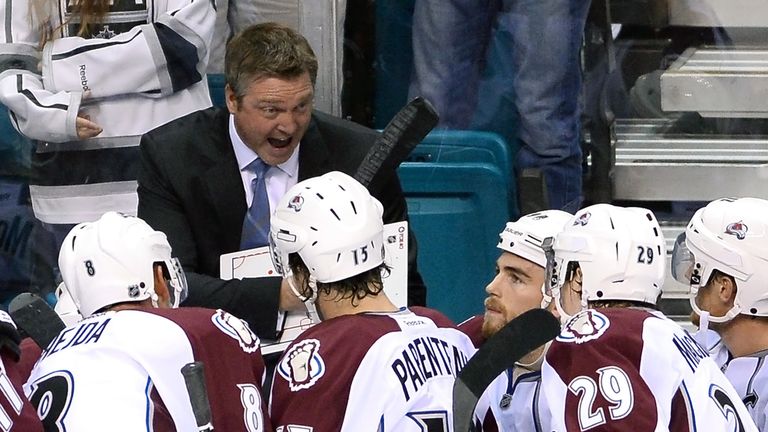 Head coach Patrick Roy of the Colorado Avalanche talks to his players during a timeout in their preseason game against the Los Angeles Kings at the MGM Grand Garden Arena on September 28, 2013 in Las Vegas, Nevada. Colorado won 3-2. 