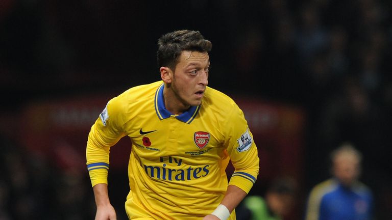 Mesut Ozil on the ball for Arsenal at Old Trafford