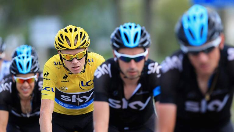 GAP, FRANCE - JULY 16:  Chris Froome of Great Britain riding for Sky Procycling is protected by his team as he defends the overall race leader's jersey dur