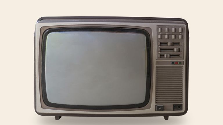 Retro television on pastel color background with space.