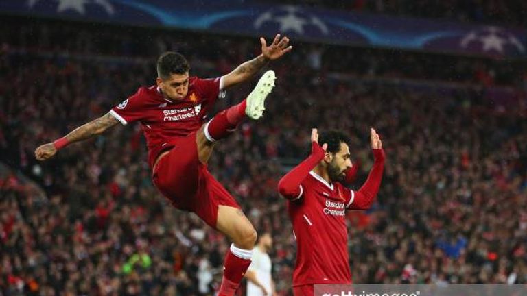 LIVERPOOL, ENGLAND - APRIL 24:  Mohamed Salah of Liverpool celebrates as he scores his sides second goal with Roberto Firmino during the UEFA Champions League Semi Final First Leg match between Liverpool and A.S. Roma at Anfield on April 24, 2018 in Liverpool, United Kingdom.  (Photo by Clive Brunskill/Getty Images)